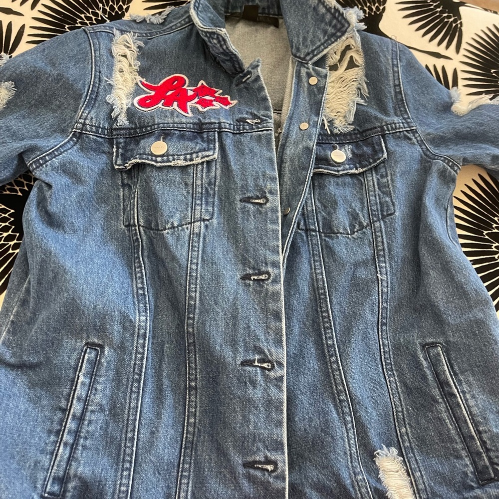 Distressed Jean jacket. L A. Squad.